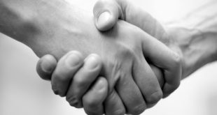 handshake business deal grey mainjpg TeleWare launches programme to find new 'passionate' partners