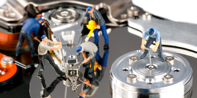 tiny workers fixing a hard disk mainjpg Over 80% of resellers see demand for third party data recovery services