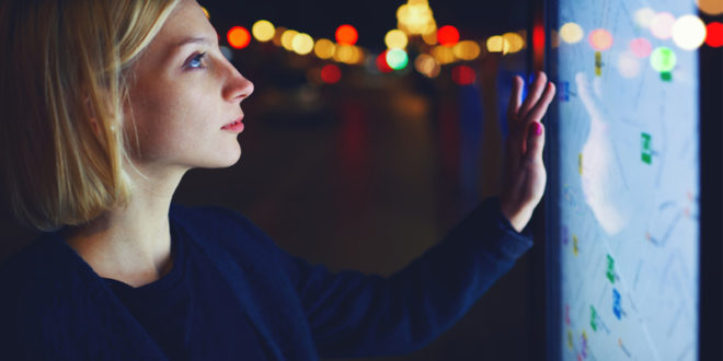 woman touch screen display wall mainjpg A guide to using multi-touch technology as a marketing tool